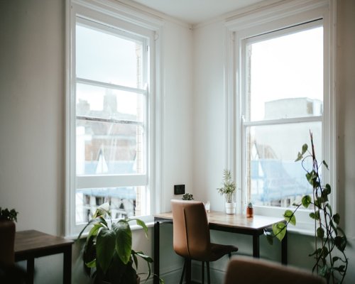 Home office setup perpendicular to a window showing indirect sunlight