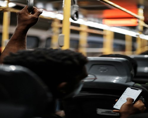 Close up of a smartphone being held on a bus